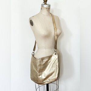 FURLA  Made in Italy. Gold Metalic Leather Handbag with adjustable Straps.